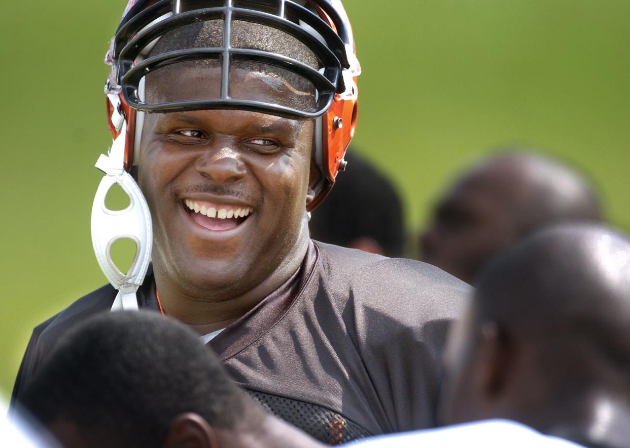 Cincinnati Bengals offensive lineman Willie Anderson laughs with teammates during training camp at Georgetown (Kentucky) College in 2004.