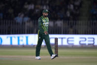 Pakistan's skipper Babar Azam walks off the field as rain stop the play of first T20 cricket match between Pakistan and New Zealand, in Rawalpindi, Pakistan, Thursday, April 18, 2024. (AP Photo/Anjum Naveed)