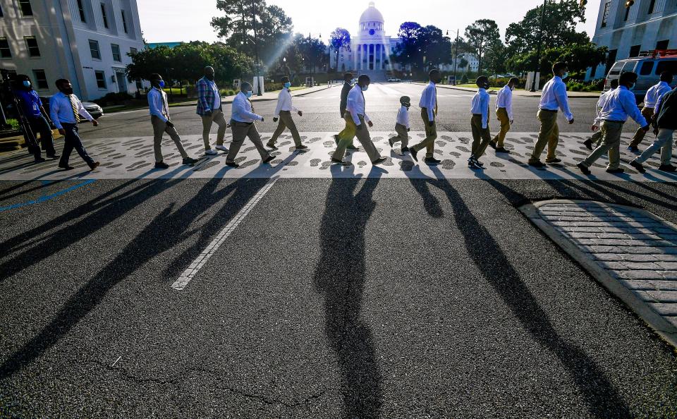 Valiant Cross Academy scholars walk across Dexter Avenue.