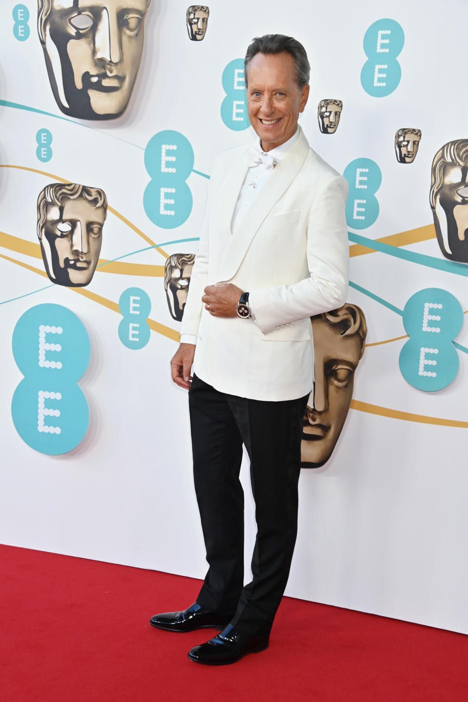 Richard E. Grant arrives at the EE BAFTA Film Awards 2023 at The Royal Festival Hall on February 19, 2023 in London, England