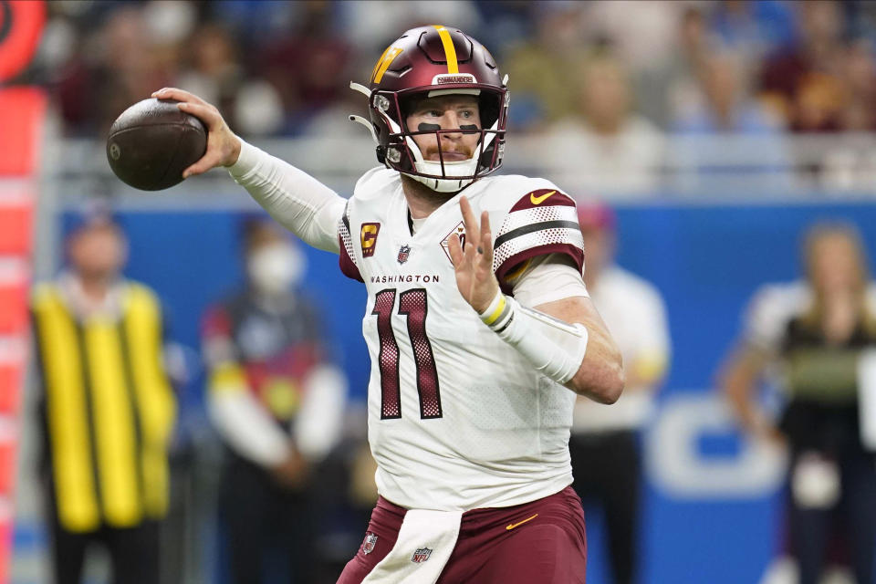 Washington Commanders quarterback Carson Wentz (11) throws a pass during the first half of an NFL football game against the Detroit Lions Sunday, Sept. 18, 2022, in Detroit. (AP Photo/Paul Sancya)