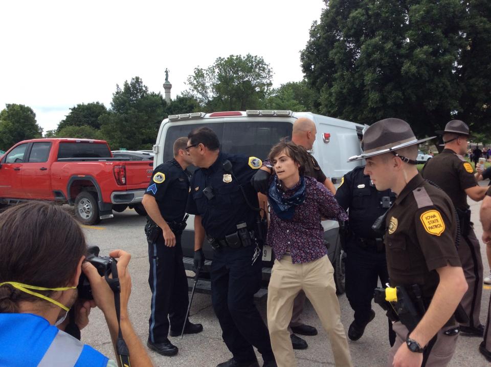 A protester is arrested outside the Iowa Capitol July 1, 2020. The arrests came during a series of brawls on the Capitol's east side.