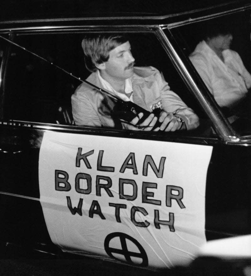 David Duke, leader of the Ku Klux Klan, patrols the California-Mexico border for illegal immigants in a “Klan Boder Watch” automobile