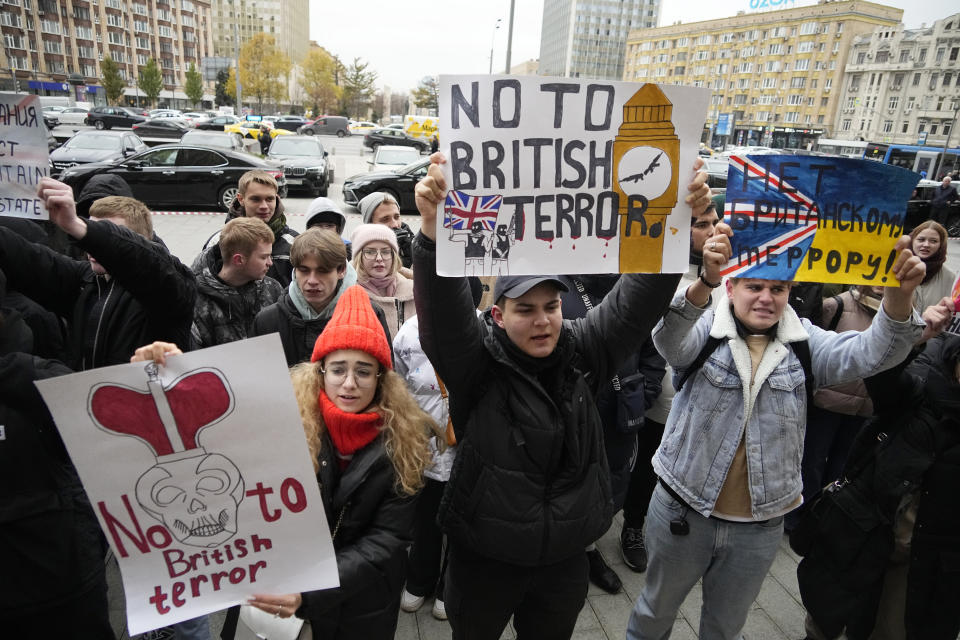 Activists hold a protest against the involvement of British specialists in a Ukrainian drone strike on its Black Sea Fleet in Crimea as British Ambassador to Russia Deborah Bronnert arrives at the Ministry of Foreign Affairs in Moscow, Russia, Thursday, Nov. 3, 2022. Moscow summoned Bronnert over its accusation that "British specialists" were involved in a Ukrainian drone attack on the Crimean port of Sevastopol, the Russia foreign ministry has said. (AP Photo/Alexander Zemlianichenko)