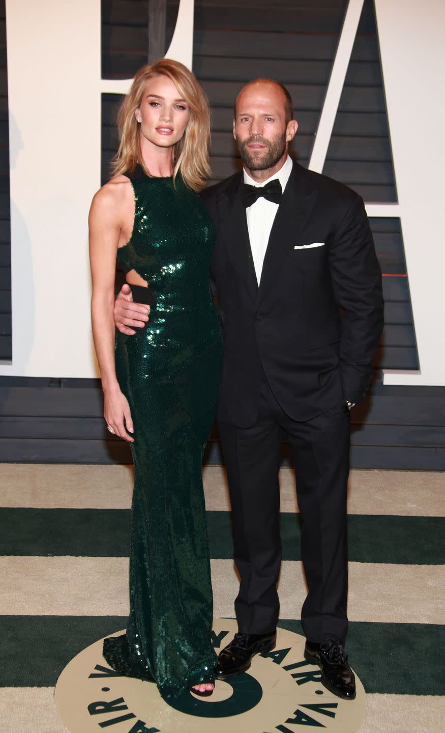 <p>Rosie Huntington-Whiteley: 5' 9" (taller in heels)<br>Jason Statham: 5' 10"<br></p>