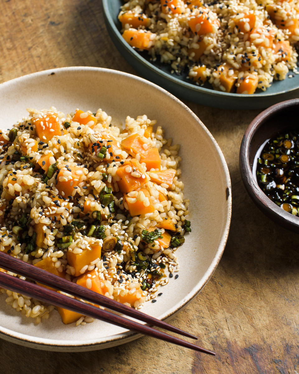 This image released by Milk Street shows a recipe for sweet potato brown rice with soy and scallions. (Milk Street via AP)
