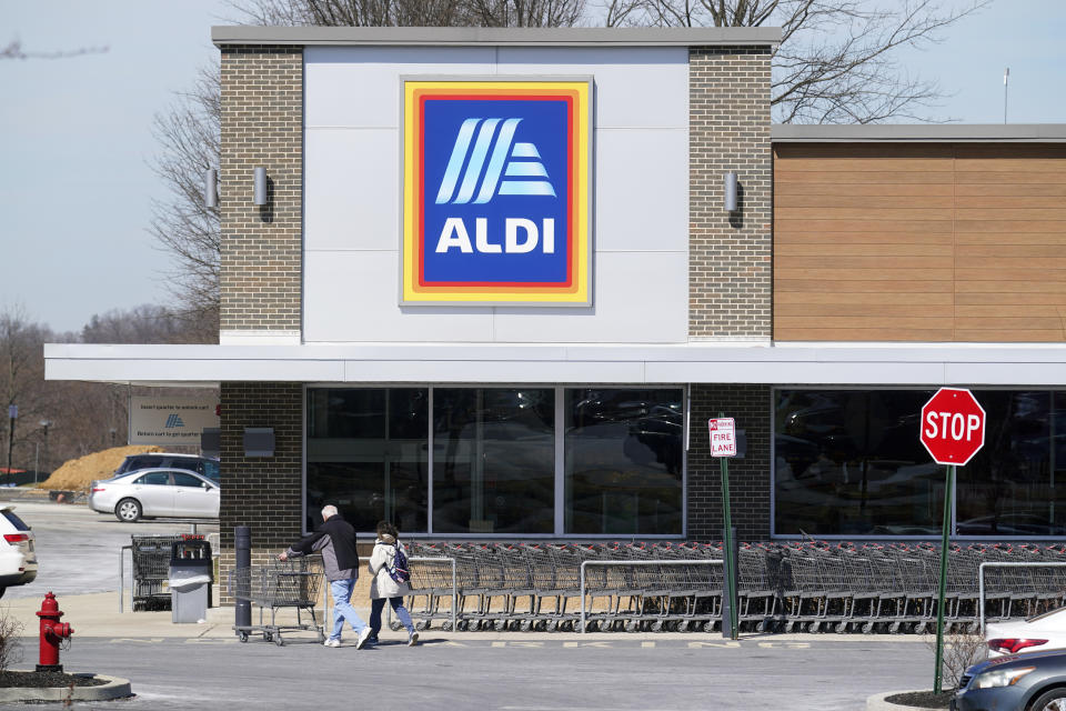 FILE - Customers walk into an Aldi supermarket in Bensalem, Pa., March 14, 2022. Discount grocer Aldi said Wednesday, Aug. 16, 2023, that it plans to buy 400 Winn-Dixie and Harveys supermarkets in the southern U.S. (AP Photo/Matt Rourke, File)