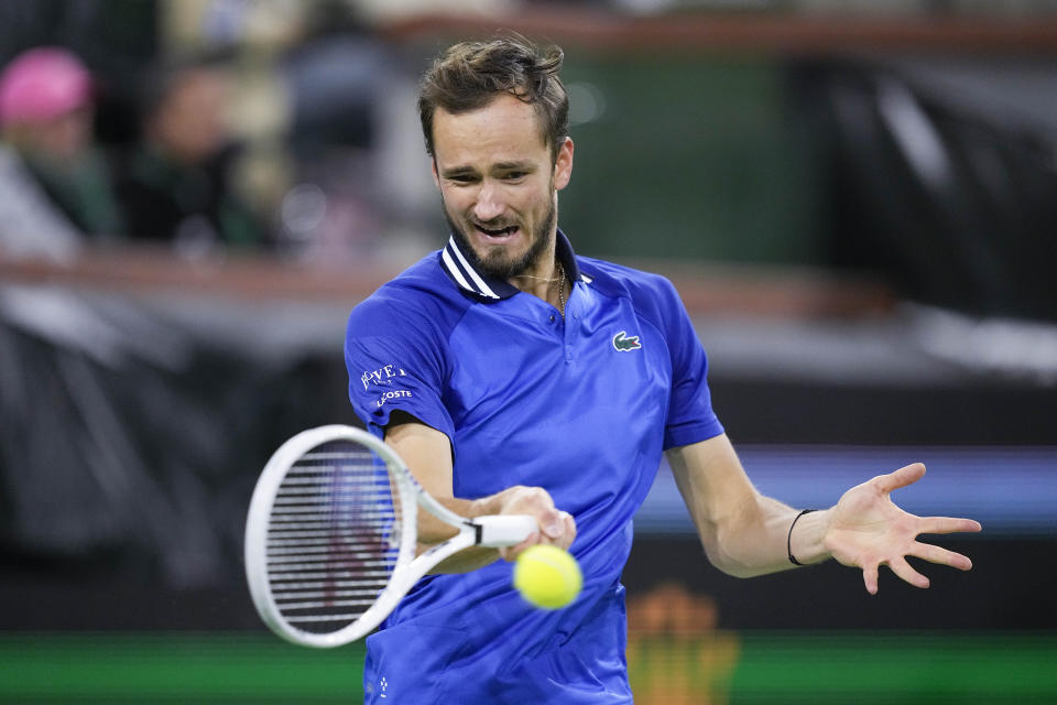 Daniil Medvedev, of Russia, returns to Holger Rune, of Denmark, during a quarterfinal match at the BNP Paribas Open tennis tournament, Thursday, March 14, 2024, in Indian Wells, Calif. (AP Photo/Mark J. Terrill)