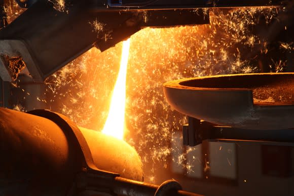 Molten metal being poured in a foundry.