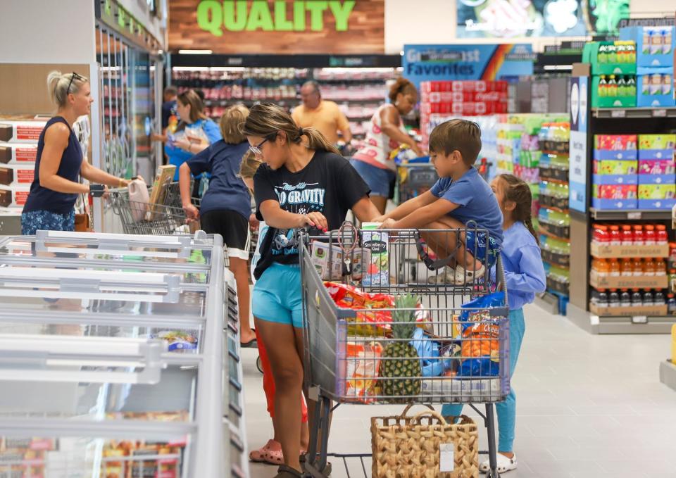 Customers shop at an Aldi in Niceville, Fla.