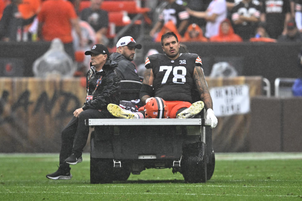 Cleveland Browns offensive tackle Jack Conklin (78) is taken off the field on a cart following an injury during the first half of an NFL football game against the Cincinnati Bengals Sunday, Sept. 10, 2023, in Cleveland. (AP Photo/David Richard)