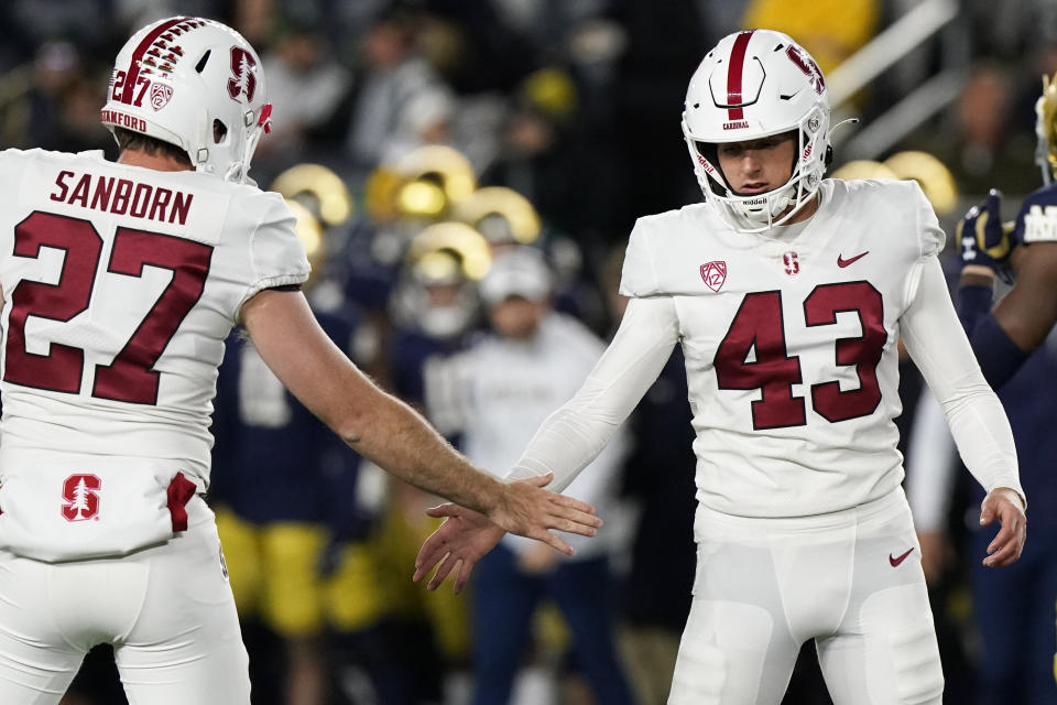 Stanford place-kicker Joshua Karty, right, celebrates with punter Ryan Sanborn after an extra point during the first half of the team's NCAA college football game against Notre Dame in South Bend, Ind., Saturday, Oct. 15, 2022. (AP Photo/Nam Y. Huh)