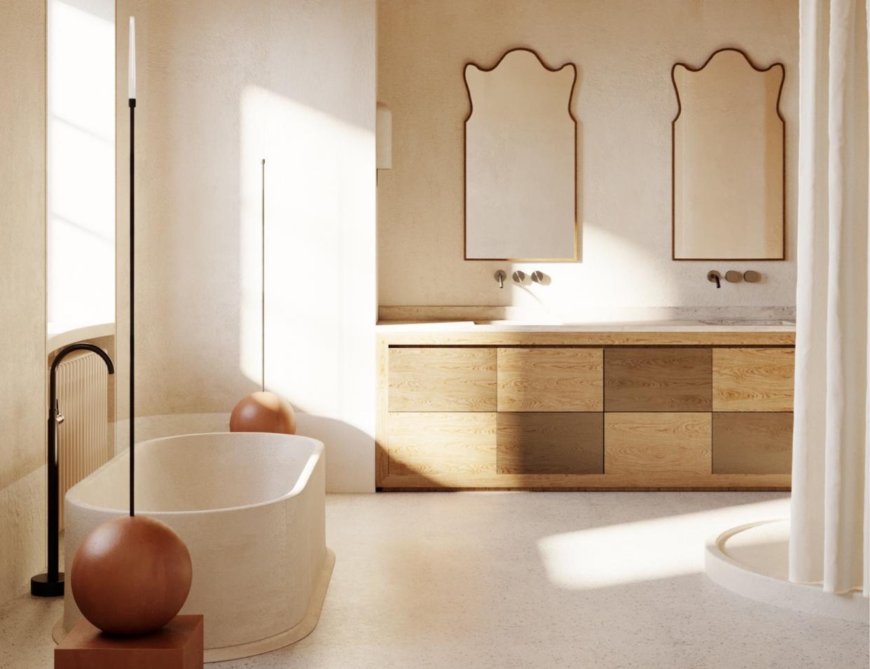  A bathroom made in natural materials with two organic-shaped mirrors adding a touch of elegance. 