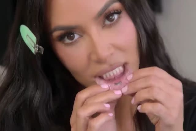 <p>Hulu/The Kardashians</p> Kim Kardashian reveals lip tattoo