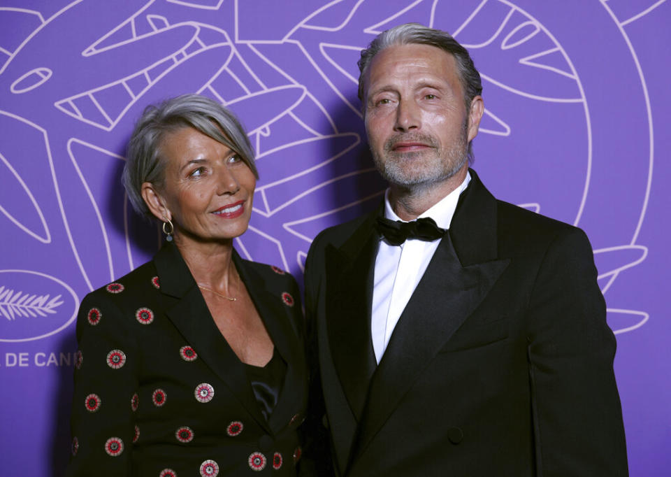 Hanne Jacobsen, left, and Mads Mikkelsen at Cannes’ 75th anniversary - Credit: Vianney Le Caer/Invision/AP