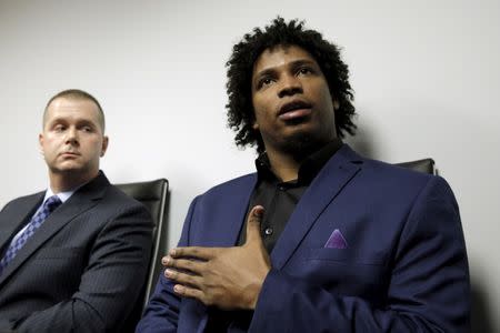 Former Major League Baseball pitcher Jenrry Mejia (R) speaks during a news conference to address his three failed doping tests and lifetime ban, in the Queens borough of New York March 11, 2016. REUTERS/Brendan McDermid