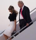 <p>The president and first lady disembark from Air Force One upon arrival at Andrews Air Force Base in Maryland following a 4-day trip to Poland and Germany for the G20 Summit.</p>