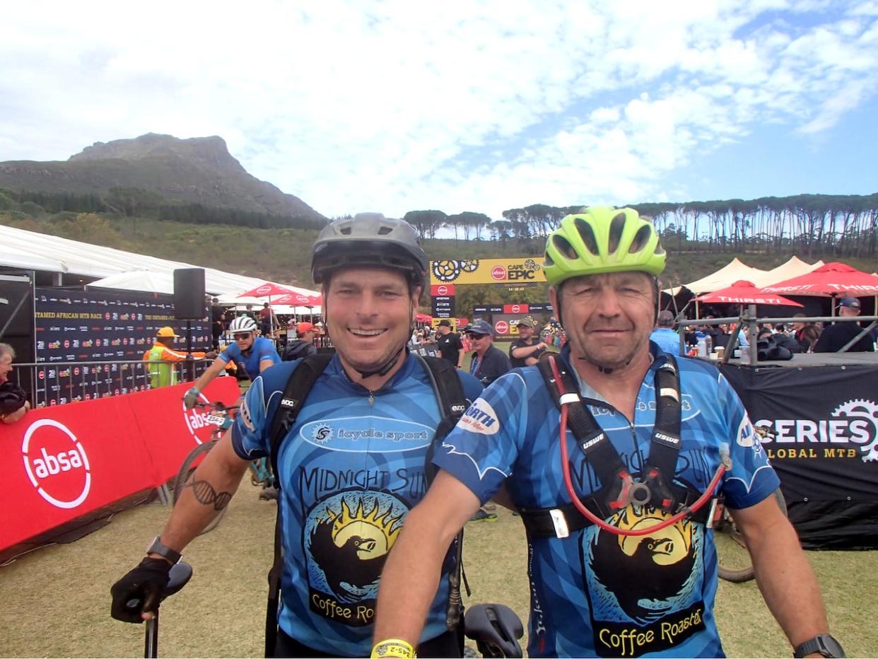 Andy Preto, left, and Thomas Tetz of the Yukon competed in the Absa Cape Epic mountain bike race in South Africa last month. 'It was challenging, for sure. It had its highs and lows,' said Preto. (Submitted by Andy Preto - image credit)