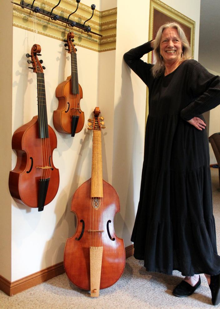 Wendy Gillespie, Alchymy member and a retired professor of viola da gamba at Indiana University&#39;s Jacobs School of Music, poses with different sizes of viola da gambas in a consort. Gillespie is one of several musicians who will be performing Feb. 6.