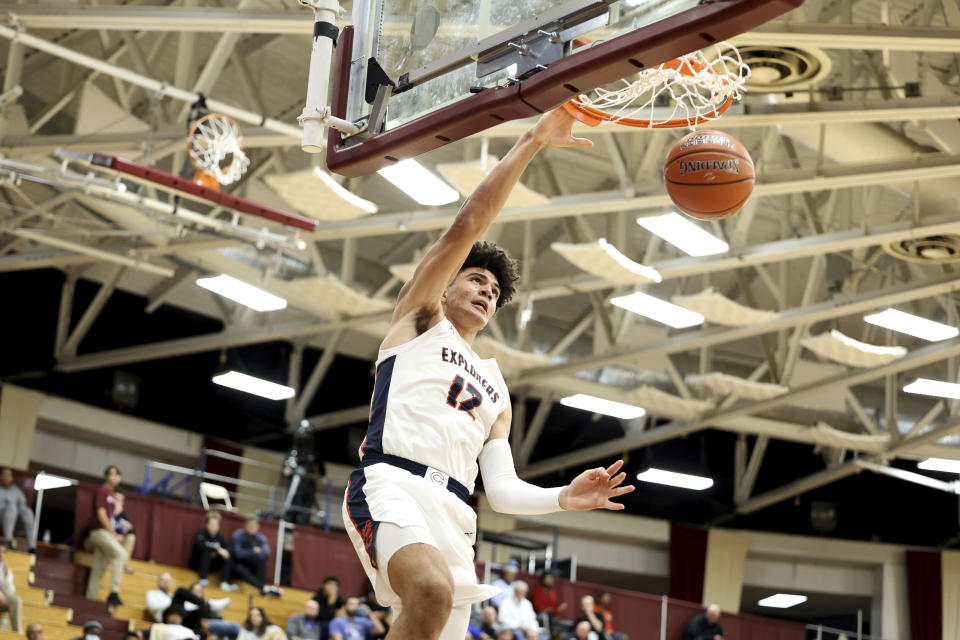 Christopher Columbus'  Cameron Boozer dunks during a high school basketball game at the Hoophall Classic in Springfield, Massachusetts, on Jan.  14, 2023. (AP Photo/Gregory Payan)