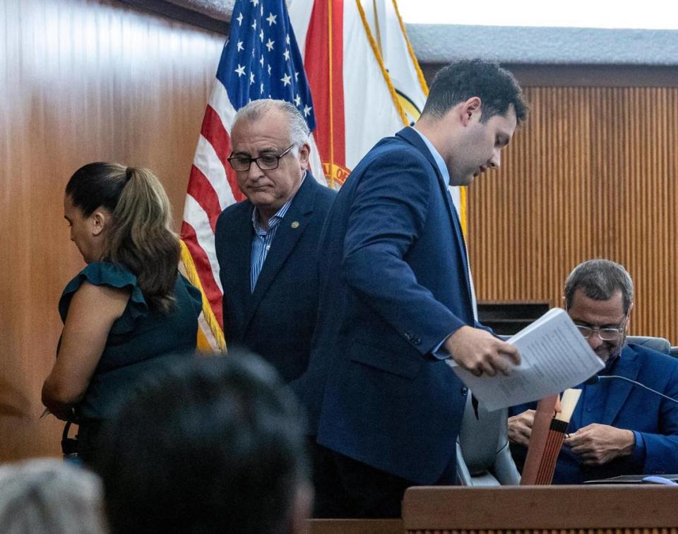 Hialeah Mayor Esteban “Steve” Bovo, center left, walks behind Councilman Bryan Calvo, center right, after the council in a special session voted on a resolution to “condemn” Calvo after he sued the mayor , alleging “systematic abuse of power.” The resolution was proposed by councilor Jesus Tundidor