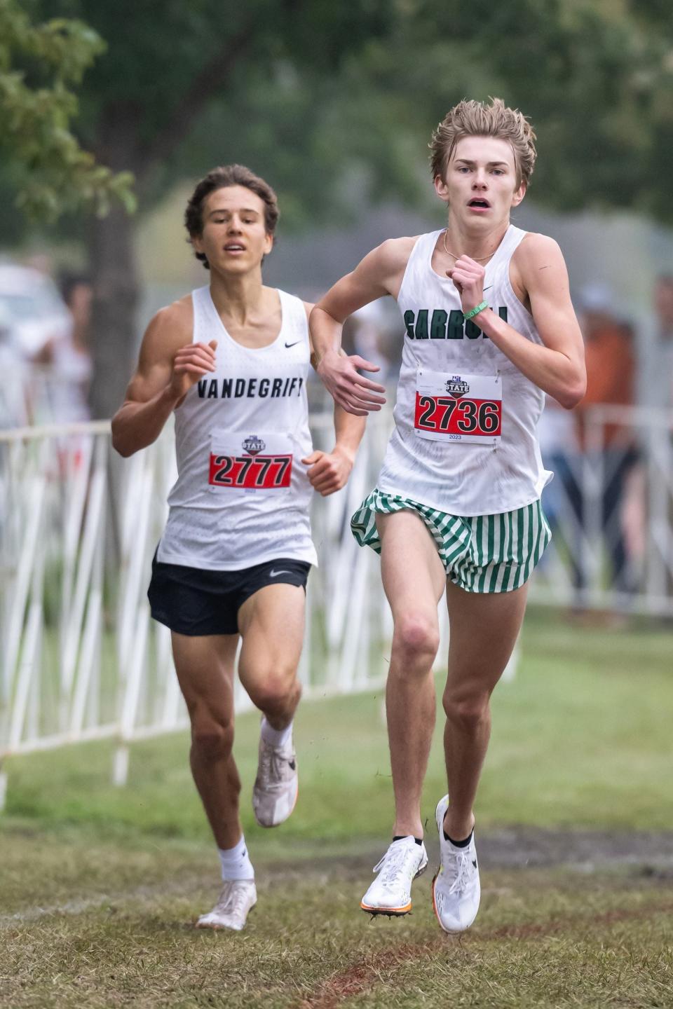 Caden Leonard from Southlake Carroll churns to victory with Vandegrift's Hudson Haley right behind him Saturday in the Class 6A boys race at the UIL state cross-country championships.