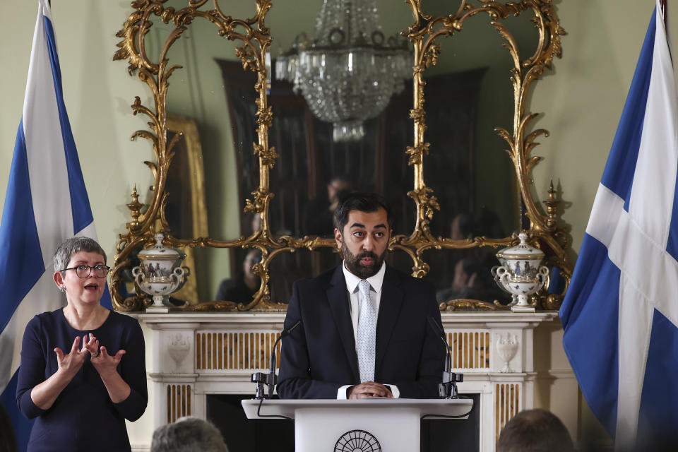 Scotland's First Minister Humza Yousaf speaks during a press conference at Bute House, Edinburgh, Thursday, April 25, 2024. Scotland’s leader is facing a potential battle for survival after ending a three-year power-sharing agreement with the Scottish Green Party following a clash over climate change policies. First Minister Humza Yousaf of the Scottish National Party informed the leaders of the much smaller Greens on Thursday that he was terminating the power-sharing agreement. (Jeff J Mitchell/PA via AP)