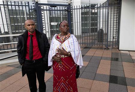 Supporters of Kenya's Deputy President William Ruto stand in front of the International Criminal Court (ICC) in The Hague September 10, 2013. REUTERS/Michael Kooren