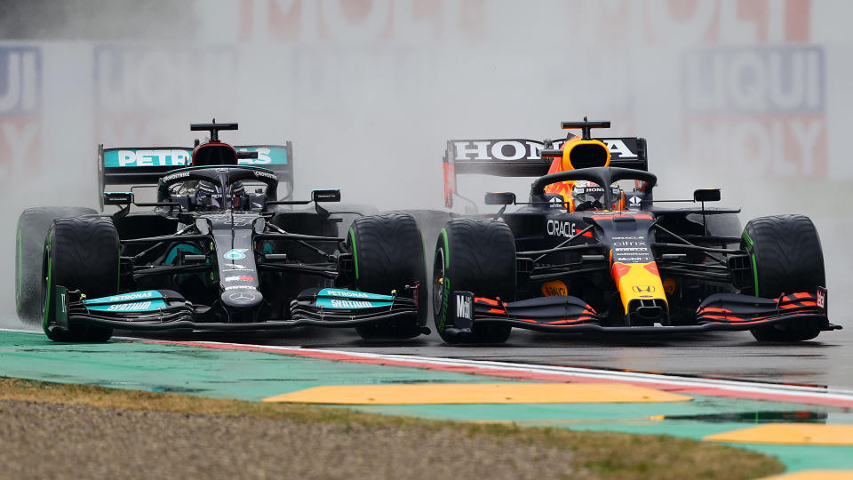 IMOLA, ITALY - APRIL 18: Max Verstappen of the Netherlands driving the (33) Red Bull Racing RB16B Honda and Lewis Hamilton of Great Britain driving the (44) Mercedes AMG Petronas F1 Team Mercedes W12 battle for track position at the start during the F1 Grand Prix of Emilia Romagna at Autodromo Enzo e Dino Ferrari on April 18, 2021 in Imola, Italy. (Photo by Bryn Lennon/Getty Images)