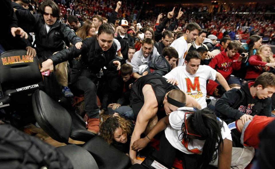 Maryland fans run over one of their own during a mad rush to the court after upsetting Duke. Duke was upset by Maryland 83-81at the Comcast Center in College Park, Maryland Saturday Jan.16, 2013.