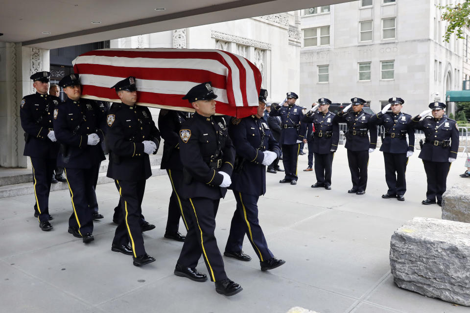 New York City Police Dept. officers carry the casket of former Manhattan District Attorney Robert Morgenthau following a funeral service at Temple Emanu-El, in New York, Thursday, July 25, 2019. (AP Photo/Richard Drew)