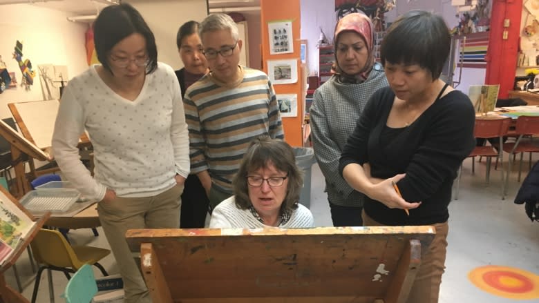 A brush with painting brings colour to newcomers' lives