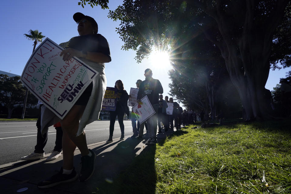 Kaiser Permanente workers picket Wednesday, Oct. 4, 2023, in Irvine, Calif. Some 75,000 Kaiser Permanente hospital employees who say understaffing is hurting patient care walked off the job Wednesday in five states and the District of Columbia, kicking off a major health care worker strike. (AP Photo/Ryan Sun)