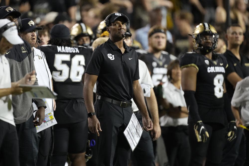 Colorado head coach Karl Dorrell, center, looks on in the second half of an NCAA college football game against TCU Friday, Sept. 2, 2022, in Boulder, Colo. (AP Photo/David Zalubowski)