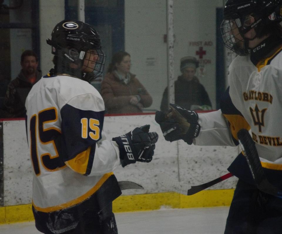 Bryton Thaxton celebrates after his third first-period goal during a high school hockey matchup between Gaylord and Petoskey on Wednesday, January 18 at the Otsego Country Sportsplex in Gaylord, Mich.