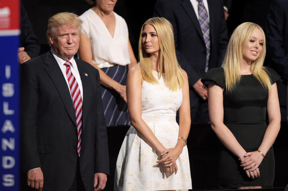 Republican presidential candidate Donald Trump, Ivanka Trump and Tiffany Trump stand during the third day of the Republican National Convention on July 20, 2016 at the Quicken Loans Arena in Cleveland, Ohio. Republican presidential candidate Donald Trump received the number of votes needed to secure the party's nomination. An estimated 50,000 people are expected in Cleveland, including hundreds of protesters and members of the media. The four-day Republican National Convention kicked off on July 18.  (Photo by Jeff Swensen/Getty Images)