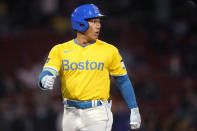 Boston Red Sox's Masataka Yoshida watches a replay on the scoreboard after flying out during the seventh inning of the team's baseball game against the Los Angeles Angels, Friday, April 12, 2024, in Boston. (AP Photo/Charles Krupa)