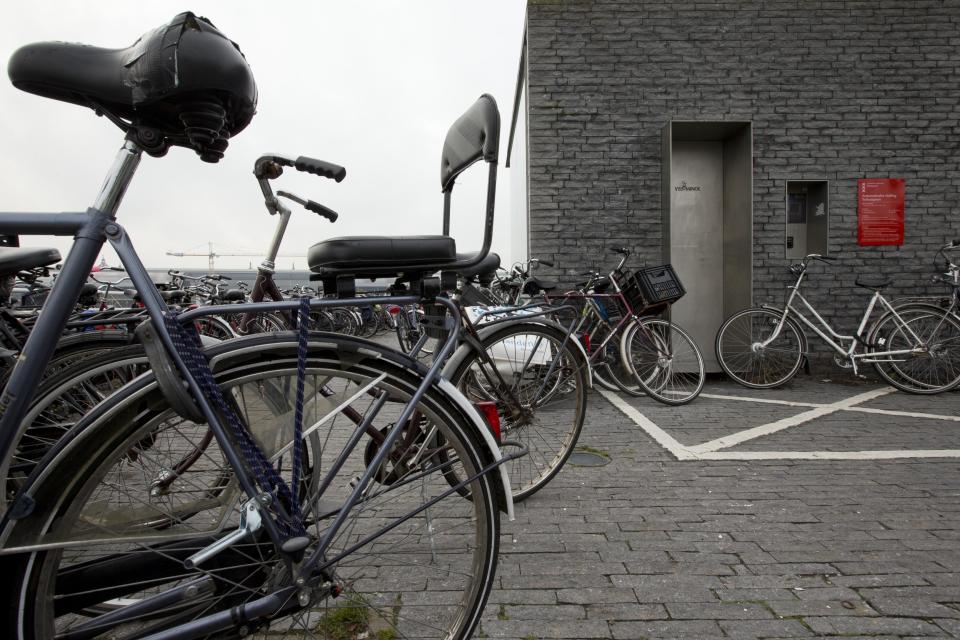 Parked bicycles block the entrance to a 50-place underground bicycle parking in Amsterdam Noord, across IJ river, Netherlands, Wednesday Oct. 31, 2012. (AP Photo/Peter Dejong)