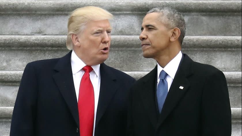 FILE - In this Friday, Jan. 20, 2017, file photo, President Donald Trump talks with former President Barack Obama on Capitol Hill in Washington, prior to Obama's departure to Andrews Air Force Base, Md. Trump relentlessly congratulates himself for the healthy state of the U.S. economy. But in the year since Trumpâ€™s inauguration, most analysts tend to agree on this: The economy remains essentially the same sturdy one he inherited from Obama. (Rob Carr/Pool Photo via AP, File)