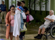 <p>People arrive at a shelter after the passage of hurricane Fiona in Salinas, Puerto Rico, on September 19, 2022.</p> 