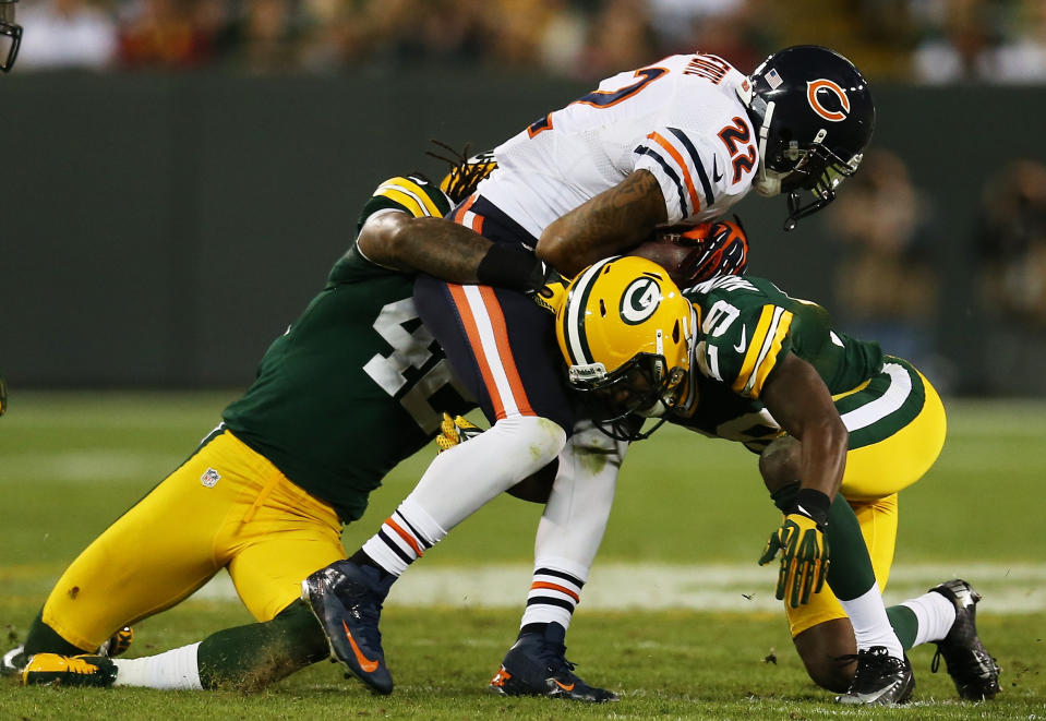 GREEN BAY, WI - SEPTEMBER 13: Running back Matt Forte #22 of the Chicago Bears runs against free safety Morgan Burnett #42 and cornerback Casey Hayward #29 of the Green Bay Packers in the second quarter at Lambeau Field on September 13, 2012 in Green Bay, Wisconsin. (Photo by Jonathan Daniel/Getty Images)