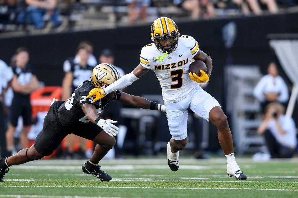 Sep 30, 2023; Nashville, Tennessee, USA; Missouri Tigers running back Nathaniel Peat (8) runs the ball against the Vanderbilt Commodores during the first half at FirstBank Stadium. Mandatory Credit: Steve Roberts-USA TODAY Sports