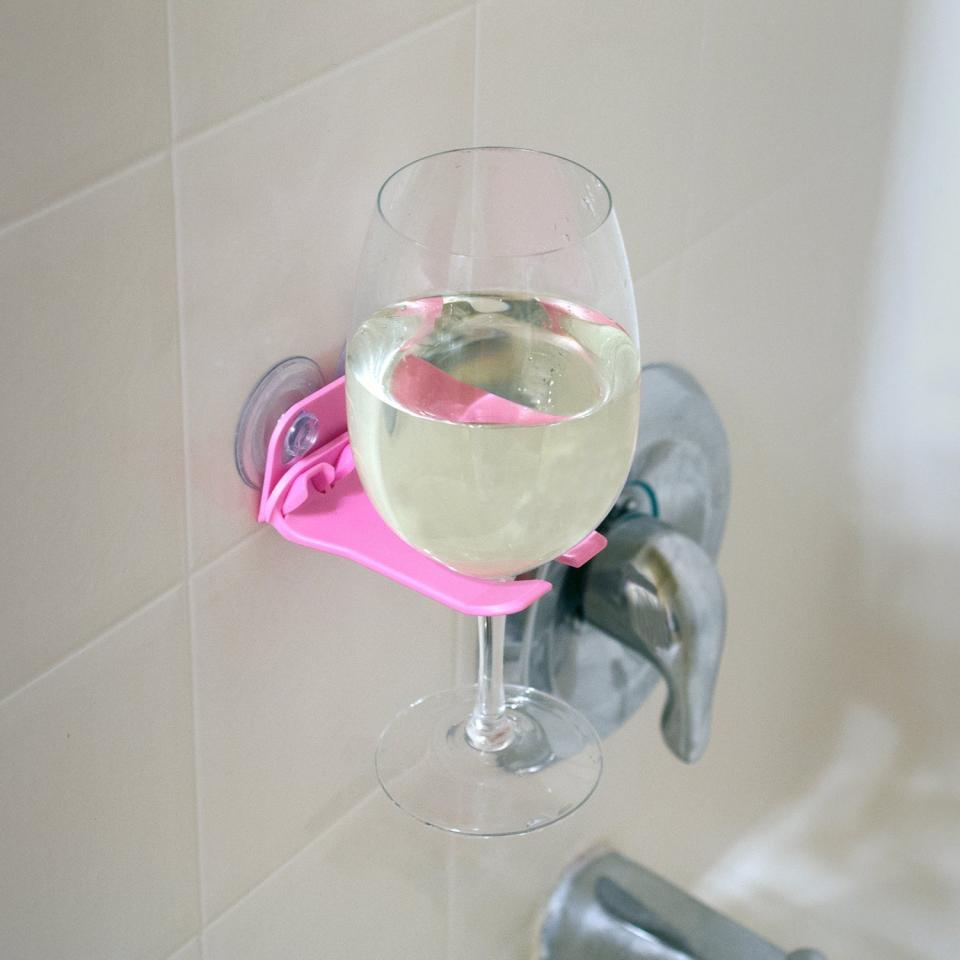 Bathtub Wine Glass Holder, $12.50 at <a href="http://www.amazon.com/WaveHooks-Bathtub-Wine-Glass-Holder/dp/B00M07HH8E/?_encoding=UTF8&amp;camp=1789&amp;creative=9325&amp;linkCode=ur2&amp;tag=thehuffingtop-20&amp;linkId=6BJYK63XAVDWSXE4" target="_blank">Amazon</a>