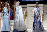 The winner of the Miss International 2016 Kylie Verzosa representing Philippines (C) poses with the first runner-up Alexandra Britton (L) representing Australia and second runner-up Felicia Hwang representing Indonesia during the 56th Miss International Beauty Pageant in Tokyo, Japan October 27, 2016. REUTERS/Kim Kyung-Hoon