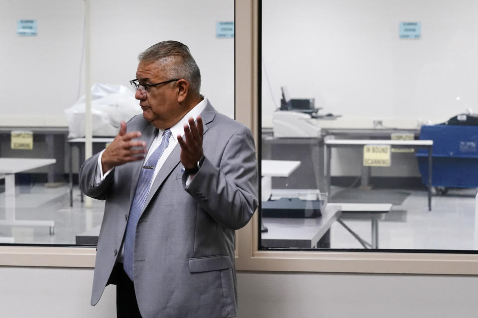 Rey Valenzuela, Maricopa County Director of Election Services and Early Voting, talks about the early voting process at the Maricopa County Elections Department in Phoenix, Thursday, Sept. 8, 2022. Maricopa County election officials, like many others around the country, have begun pushing back against a flood of misinformation related to voting that often leads to public confusion and anger. (AP Photo/Ross D. Franklin)