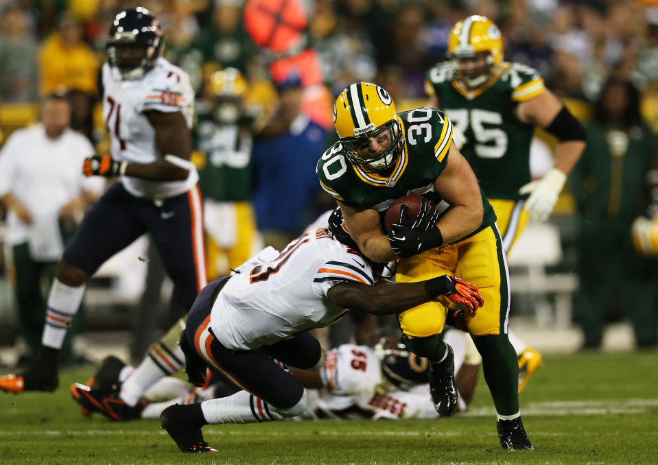 GREEN BAY, WI - SEPTEMBER 13: Strong safety Major Wright #21 of the Chicago Bears defends against running back John Kuhn #30 of the Green Bay Packers in the second quarter at Lambeau Field on September 13, 2012 in Green Bay, Wisconsin. (Photo by Jonathan Daniel/Getty Images)