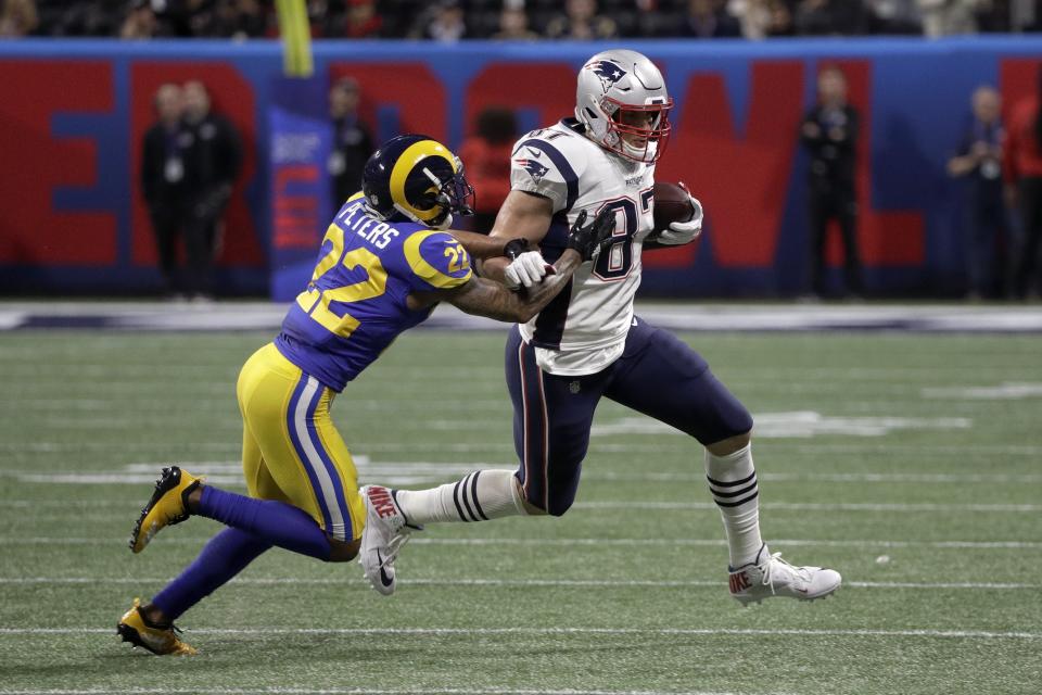 Los Angeles Rams' Marcus Peters, left, chases New England Patriots' Rob Gronkowski during the first half of the NFL Super Bowl 53 football game Sunday, Feb. 3, 2019, in Atlanta. (AP Photo/David J. Phillip)