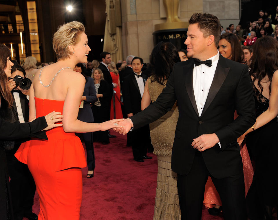 Jennifer Lawrence, left, and Channing Tatum shake hands at the Oscars on Sunday, March 2, 2014, at the Dolby Theatre in Los Angeles. (Photo by Chris Pizzello/Invision/AP)