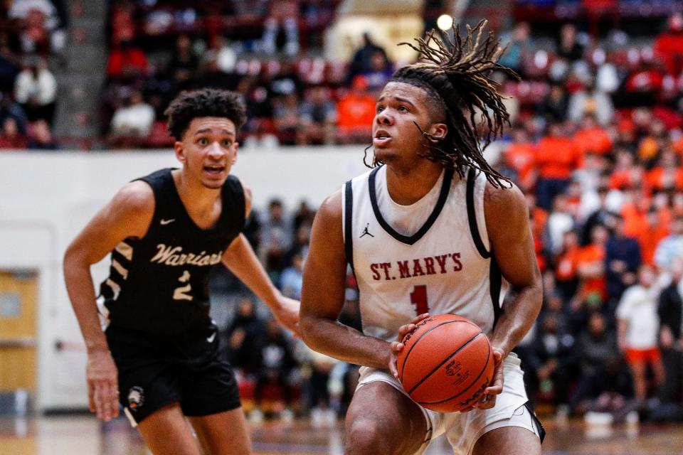 Orchard Lake St. Mary's guard Trey McKenney goes to the basket against Birmingham Brother Rice during the second half of MHSAA Division 1 quarterfinal at Calihan Hall in Detroit on Tuesday, March 12, 2024.