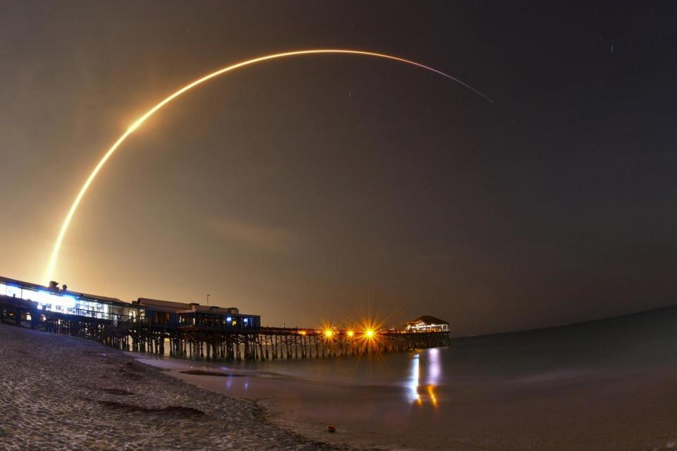 Amazing images show the rocket soar above the Cocoa Beach Pier, Florida (AP)